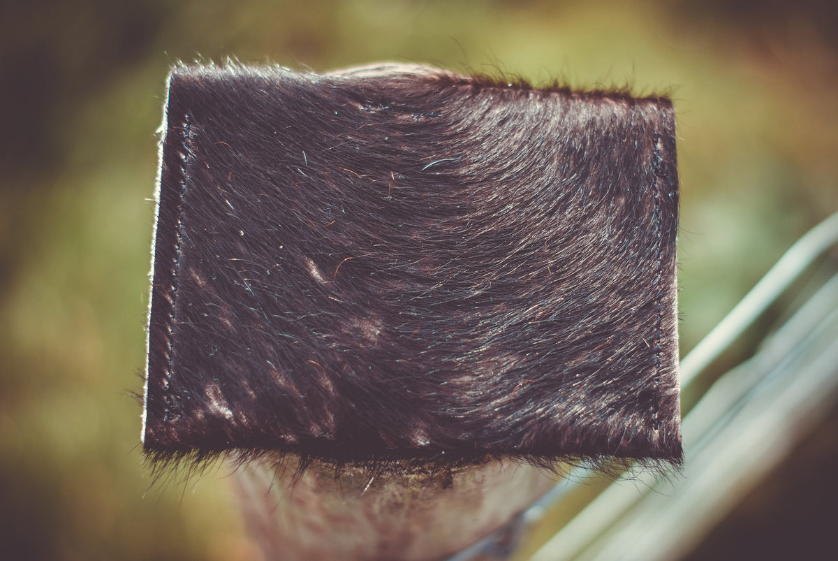 Small cowhide purse with smooth back panel, no visible hardware
