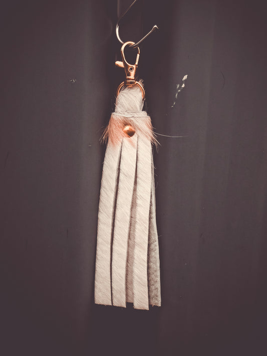 Fringed cowhide keyring bag charm with striped leather tassel and metal clasp